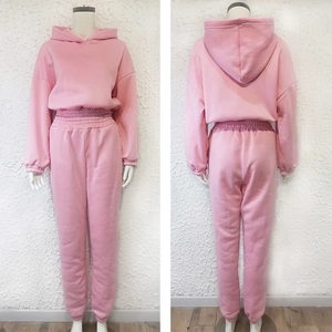 Front and back view of pink hooded tracksuit set with long sleeve top and jogger pants
