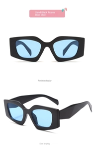Detail view of sand black frame and blue lenses on stylish cat-eye kids sunglasses