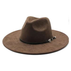 Close-up of wide-brimmed brown suede fedora with black leather band and silver buckle