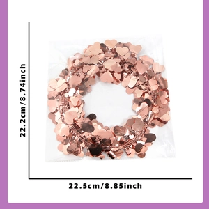 Rose gold heart-shaped sequins garland in packaging with dimensions shown in inches