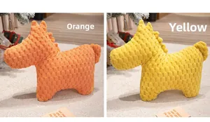 Detail of horse plush pillows in orange and yellow with textured bubble fleece fabric