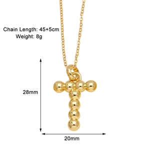 Detail view of gold beaded cross pendant necklace with 28mm by 20mm dimensions