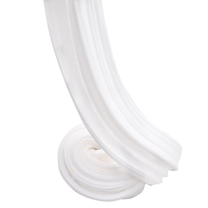 Macro shot of white fluffy cotton butter slime being squeezed into a spiral shape