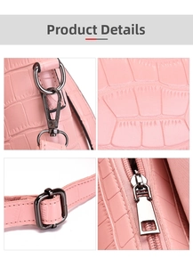 Close-up of pink crocodile texture bag with dark silver metal hardware and buckles