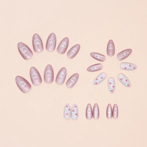 Almond fake nails featuring pink glitter hearts and cute strawberry cat-eye patterns