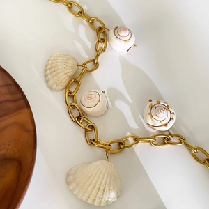 Exaggerated stainless steel chain necklace with natural white sea shells and conchs