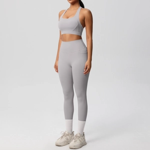 Detail of high-waisted yoga leggings with side pockets and racerback sports bra set