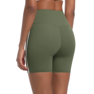 Detail view of high-waist olive yoga shorts with white side stripes and body-hugging fit