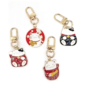 Japanese lucky cat alloy keychains in red, black, and white colors with gold lobster clasps