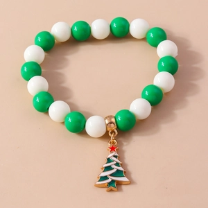 Detailed macro view of Christmas beaded bracelet with a green Christmas tree charm