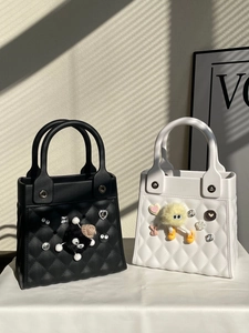 Detail of DIY waterproof EVA tote bag with elegant cannage quilting and cartoon charms