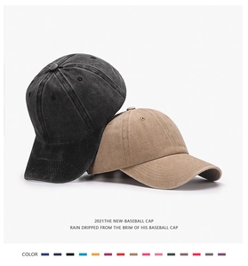 Detail of soft washed cotton texture on vintage baseball caps in black and khaki colors