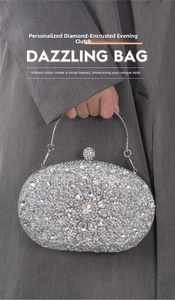 Detailed view of silver crystal evening clutch with sunflower rhinestone pattern