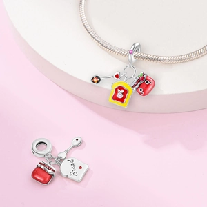 925 silver breakfast charm featuring strawberry jam and toast on a pink background