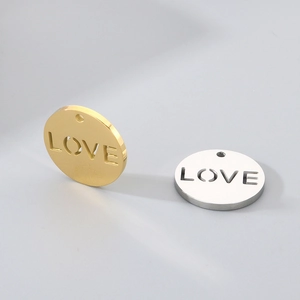 Polished stainless steel round hollow LOVE charms in gold and silver finishes