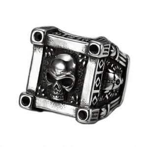 Vintage silver punk skull ring with gothic relief patterns and black accents