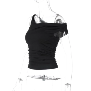 Detail of black one-shoulder cropped top with pleated texture and slim fit design