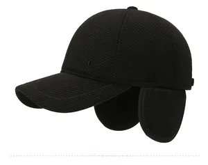 Detailed side view of black winter baseball cap with ear flaps and twill texture