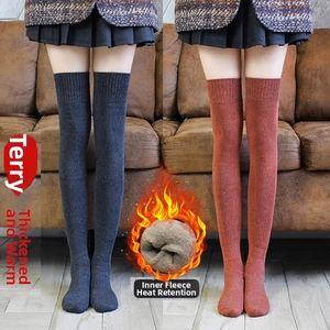 Detailed view of fleece-lined heat retention and thickened terry fabric on thigh high socks