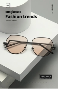 Detail of pilot-style hexagonal sunglasses with amber lenses on a white pedestal