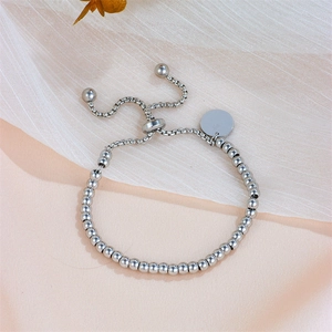 Adjustable stainless steel bead bracelet with blank round tag on soft fabric