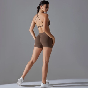Detailed back view of brown seamless yoga set with cross straps and scrunch butt shorts