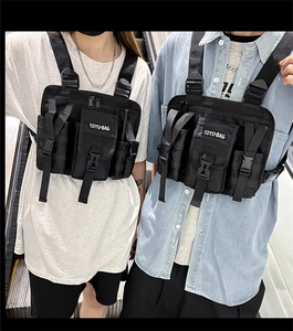 Close-up of black tactical chest rig with durable nylon pockets and white TOYLI-BAG logo
