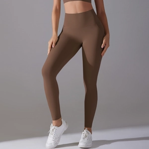 Detail view of high-waist brown yoga leggings with seamless knitting and high elasticity