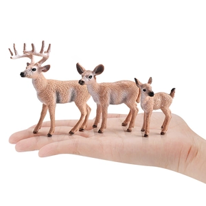 Realistic white-tailed deer figurine set featuring stag, doe, and fawn held in palm