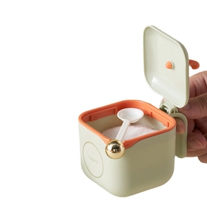 Green kitchen seasoning box with orange accents, single-hand press lid and small spoon