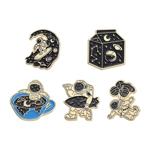 Cute astronaut enamel pins set featuring space motifs on a clean white background