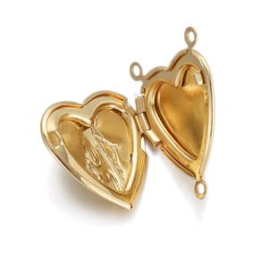 Detail of heart-shaped gold-plated locket pendant with textured interior for DIY jewelry