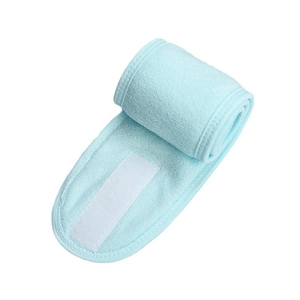 Close-up of soft ice blue microfiber headband featuring an adjustable white velcro closure