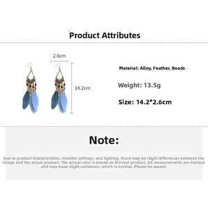Detailed view of Bohemian feather earrings with dimensions 14.2cm length and bead accents