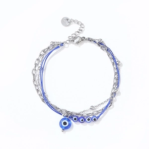 Multilayer stainless steel evil eye bracelet with blue glass beads and lobster clasp