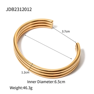 18k gold plated stainless steel triple layer ribbed open cuff bracelet on white background