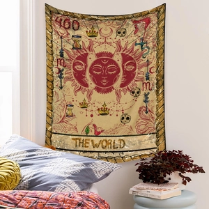 Detail of bohemian tarot tapestry featuring The World sun and moon design on bedroom wall