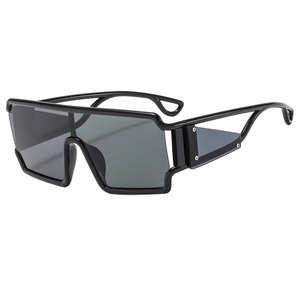 Retro futuristic oversized shield sunglasses with hollow frames and punk side shield detail