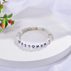 Detail of amazonite bead bracelet with 'BEST MOM' letter beads and heart symbols