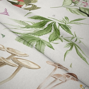 Macro shot of retro botanical mushroom and floral prints on textured fabric background
