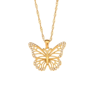 Minimalist gold butterfly pendant necklace with zircon accents on a water wave chain