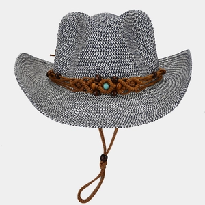 Detail of blue and white woven straw cowboy hat with turquoise bead and wood accents