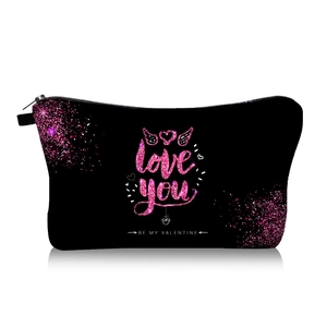 Close-up of Love You digital print and heart wing design on black canvas cosmetic bag