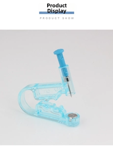 Detail of disposable piercing gun with stainless steel needle in sky blue plastic casing