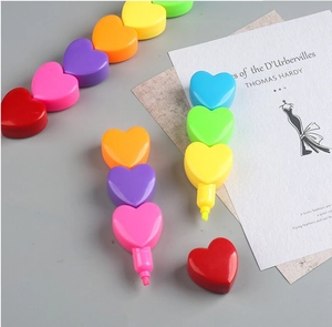 Macro shot of detachable heart-shaped highlighters in multiple bright colors for journaling
