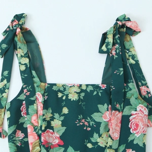 Floral print midi dress in dark green with adjustable bow tie straps and square neckline