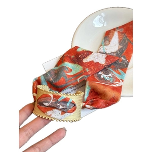 Vintage matte gold hollow open bangle featuring an artistic orange silk scarf inlay