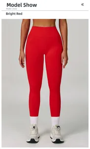 Detail view of bright red high waist seamless yoga pants on model with elastic fabric