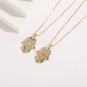 Minimalist 14K gold plated Hamsa hand necklaces featuring evil eye pendants and box chains