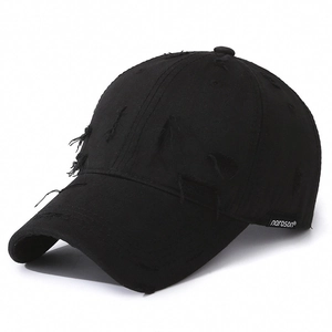 Distressed vintage black cotton baseball cap with washed ripped details and side brand label